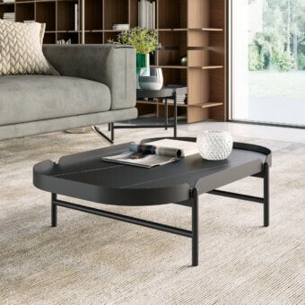 Exceptional Dallagnese Cosmo coffee table with gently rounded silhouette and slender metal rod legs in matte dark gray finish