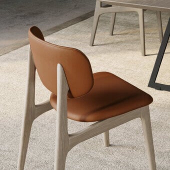 Exceptional Dallagnese Float chair with handcrafted solid ash wood frame and reddish-brown leather upholstery with double-riveted stitching