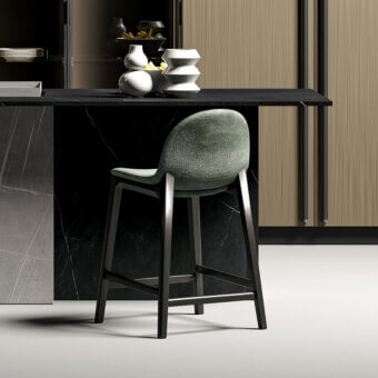 Elegant Dallagnese Hull stool with textured grayish-green textile upholstery and matte black metal frame
