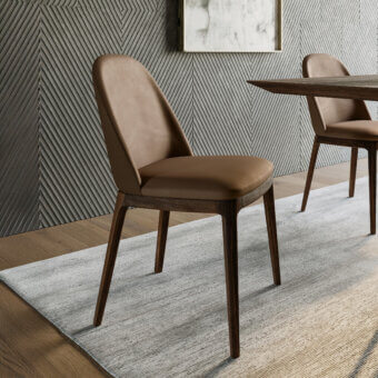 Elegant Dallagnese Joelle chair crafted with solid wood and high-quality fabric upholstery in a warm brownish tone with a curved silhouette