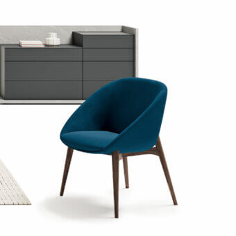Elegant Dallagnese Le Mans chair with deep teal blue fabric upholstery and warm satin-finish wooden base crafted in Italy