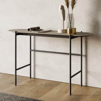 Elegant Dallagnese Supernova console with gently curved muted gray stoneware top and sleek black metal frame exhibiting a matte finish