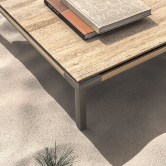 Superior Ethimo Baia coffee table with warm beige striated stone tabletop and muted gray metal base crafted in Italy