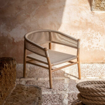 Sophisticated Ethimo Kilt lounge chair crafted in FSC-certified teak with natural fiber weave and warm beige wood tone