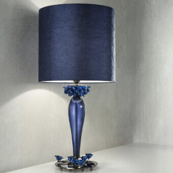 Distinguished Euroluce Bora lamp crafted in translucent blue glass with a dark blue textured textile lampshade and sculpted floral details