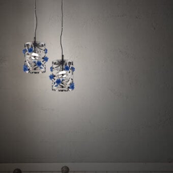 Elegant Euroluce Bora S1 suspension lamp crafted in porcelain with a silver spiral and vibrant blue decorations