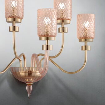 Distinguished Euroluce Dely wall lamp crafted with golden metal arms and handblown amber glass components with balloton texture