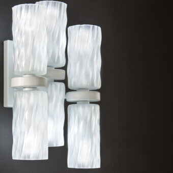 Captivating Euroluce Iceberg wall lamp crafted in translucent white glass with a light-toned metallic backplate and handcrafted cortex finish