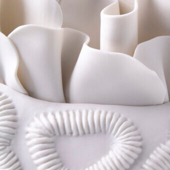 Elegant FOS Ceramiche Antholia vase crafted in white biscuit porcelain with a delicate madreporic texture and matte finish