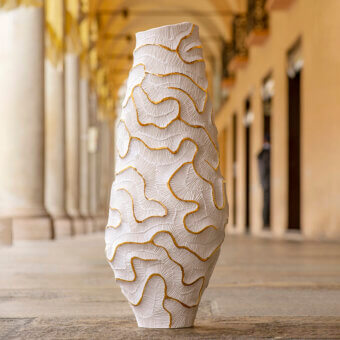 Lavish FOS Ceramiche Monolite 23K Gold vase crafted from biscuit porcelain with luminous gold accents and a textured surface