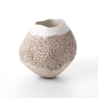 Exceptional FOS Ceramiche Oceania vase crafted in Italian porcelain with tactile protrusions and smooth rim