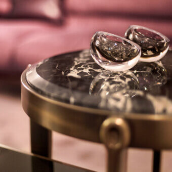 Exceptional Giorgetti Ago side table crafted in Canaletto walnut with dark grey marble and satin brass-toned metal base