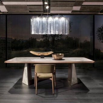 Superior Giorgetti Amadeus table crafted with Canaletto walnut and marble inserts in a satin finish