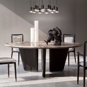Distinguished Giorgetti Mistral round table with a marble top divided by a bronze insert and veneered ash wood legs