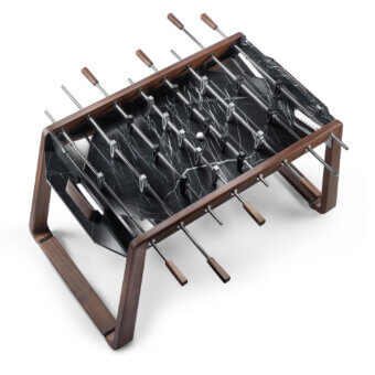 Elegant Impatia Derby signature foosball crafted with walnut wood and Taj Black Quartzite with satin and glossy finish