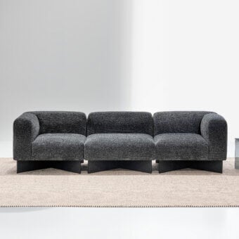Distinguished LaCividina Create sofa upholstered in dark gray textured textile with graphite stained ash wood base