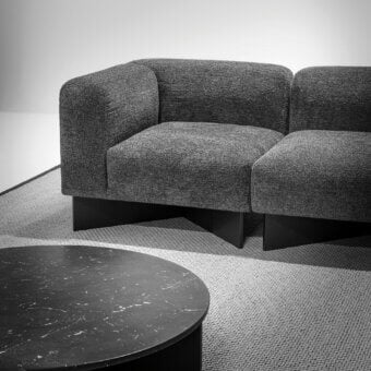 Exceptional LaCividina Create sofa upholstered in medium gray textured fabric with graphite stained ash wood base and matte finish