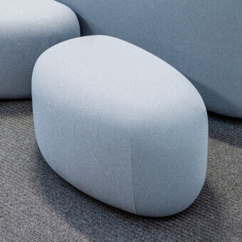 Elegant LaCividina Lisse ottoman with organic form upholstered in smooth two-way stretch fabric presenting a light blue-grey hue