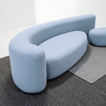 Superior LaCividina Lisse sofa with sinuous contemporary form upholstered in muted light blue two-way stretch fabric