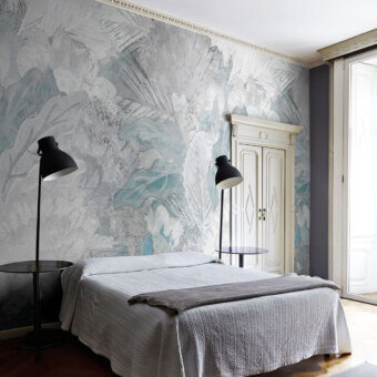 Distinguished LondonArt Welcome Back wallpaper displays layered plants and grasses in cool blue and gray hues with a subtle matte finish