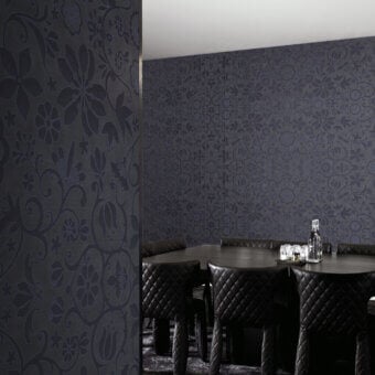 Distinguished LondonArt Amsterdam wallpaper showcases dense floral patterns in dark charcoal tones with a textured surface