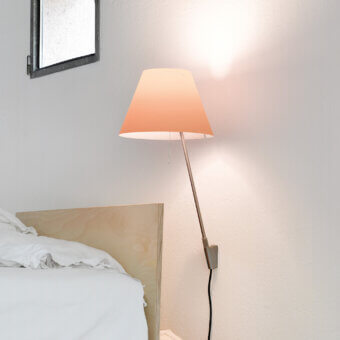Superior Luceplan Costanzina wall lamp with peach-toned polycarbonate shade and satin-finish aluminum stem