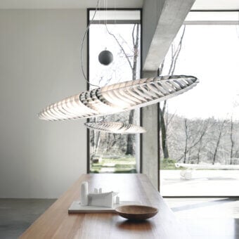 Distinguished Luceplan Titania suspension lamp crafted in light-colored wood with a satin finish and a layered semi-transparent effect