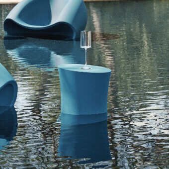 Captivating MY YOUR Iris coffee table crafted in recyclable Poleasy with muted blue finish and cylindrical form