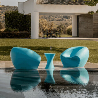 Elegant MY YOUR Iris Lounge chair in vibrant teal blue recyclable Poleasy with a smooth glossy finish