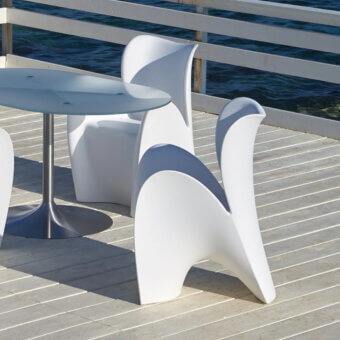 Distinguished MY YOUR Lily chair embodies organically curved form with smooth matte white synthetic material crafted by MoreDesign in Italy