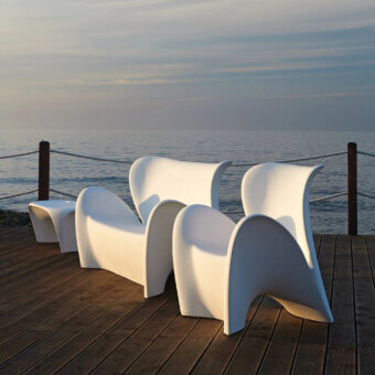 Sophisticated MY YOUR Lily lounge chair with organically curved form sculpted in pristine matte synthetic material