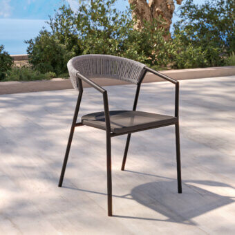 Elegant MY YOUR Maja armchair crafted with light gray synthetic rope and a dark gray powder-coated aluminum frame
