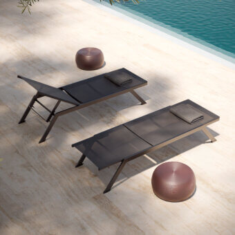 Elegant MY YOUR Maja lounger built with dark grey woven textile and lightweight aluminum in a matte finish