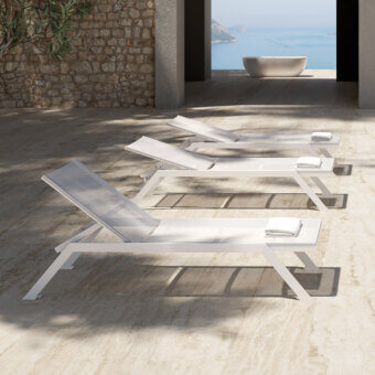 Refined MY YOUR Maja lounger crafted with lightweight aluminum and a smooth matte white finish