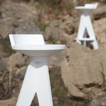 Distinguished MY YOUR Oxford stool in white durable plastic mimics a tripod form with a smooth matte finish
