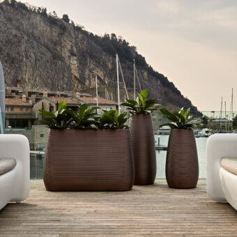 Elegant MY YOUR Pandora planter crafted in warm brown Poleasy® with an embossed linear pattern