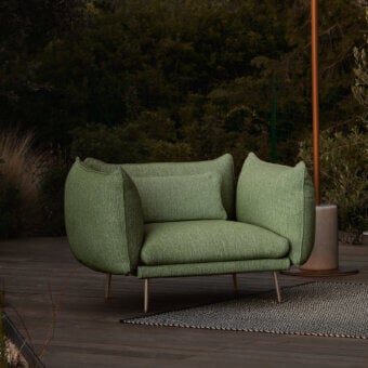 Distinguished MY YOUR Piuma lounge chair with textured green outdoor fabric upholstery and durable aluminum structure crafted in Italy