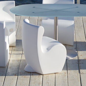 Elegant MY YOUR Rhonda chair with cocoon form molded in uniformly white synthetic material and glossy finish