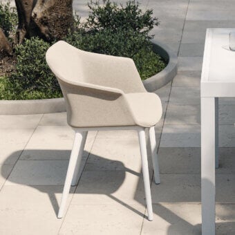 Distinguished MY YOUR Italian Outdoor Experience armchair with gently curved form in neutral beige textile and velvet finishing