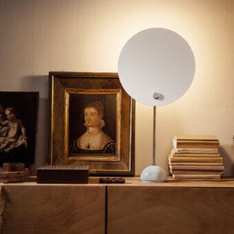 Distinguished Nemo Kuta table lamp crafted in Italy with a matte white metal form and geometric circular shade
