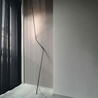 Distinguished Nemo Neo floor lamp crafted in aluminum and technopolymer with a matte black finish offering diffused illumination