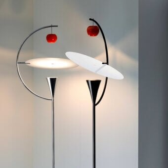 Distinguished Nemo Newton floor lamp with curved silhouette, luminous white shade and vibrant red apple-shaped diffuser in glossy black metal