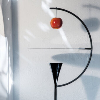 Exceptional Nemo Newton floor lamp crafted in glossy black metal with a satin conical shade and vivid red apple