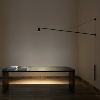 Superior Nemo Lighting Swan wall lamp crafted in matte black metal with articulated arm and leather counterweight