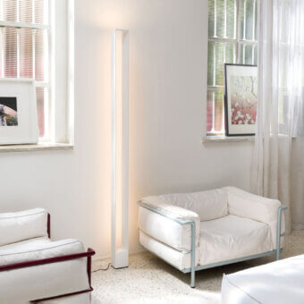 Exceptional Nemo Tru floor lamp with slender aluminum form and matte off-white finish emitting diffused light