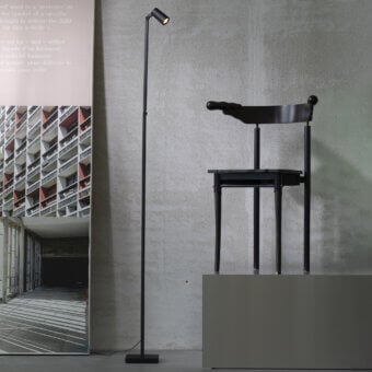 Exceptional Untitled Reading Floor Lamp with metal construction and matte black finish delivers focused illumination