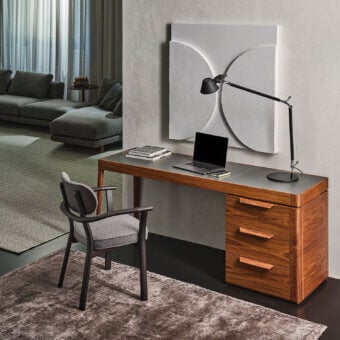 Distinguished Porada Afordite desk crafted in solid Canaletta walnut with a natural finish exhibiting a sleek rectangular silhouette and integrated storage