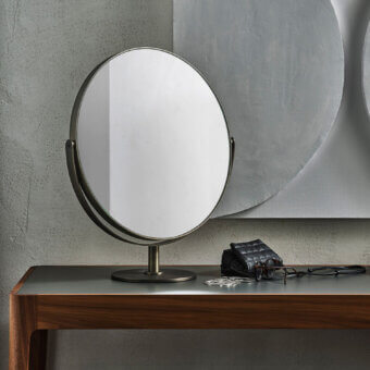Refined Porada Afrodite mirror crafted in brushed bronzed brass with a dark, greyish-bronze tone and adjustable design