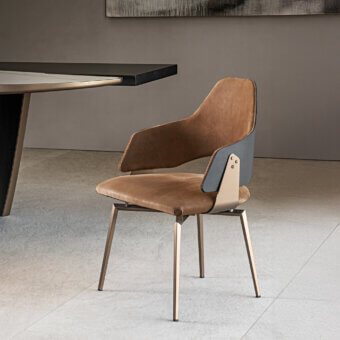 Distinguished Shake Chloe armchair with varnished steel, acrylic fibre upholstery and curved ash plywood backrest finished in warm tan textile