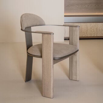 Distinguished Shake Ego armchair with varnished steel, solid ash wood, and smooth textile upholstery in a muted beige tone